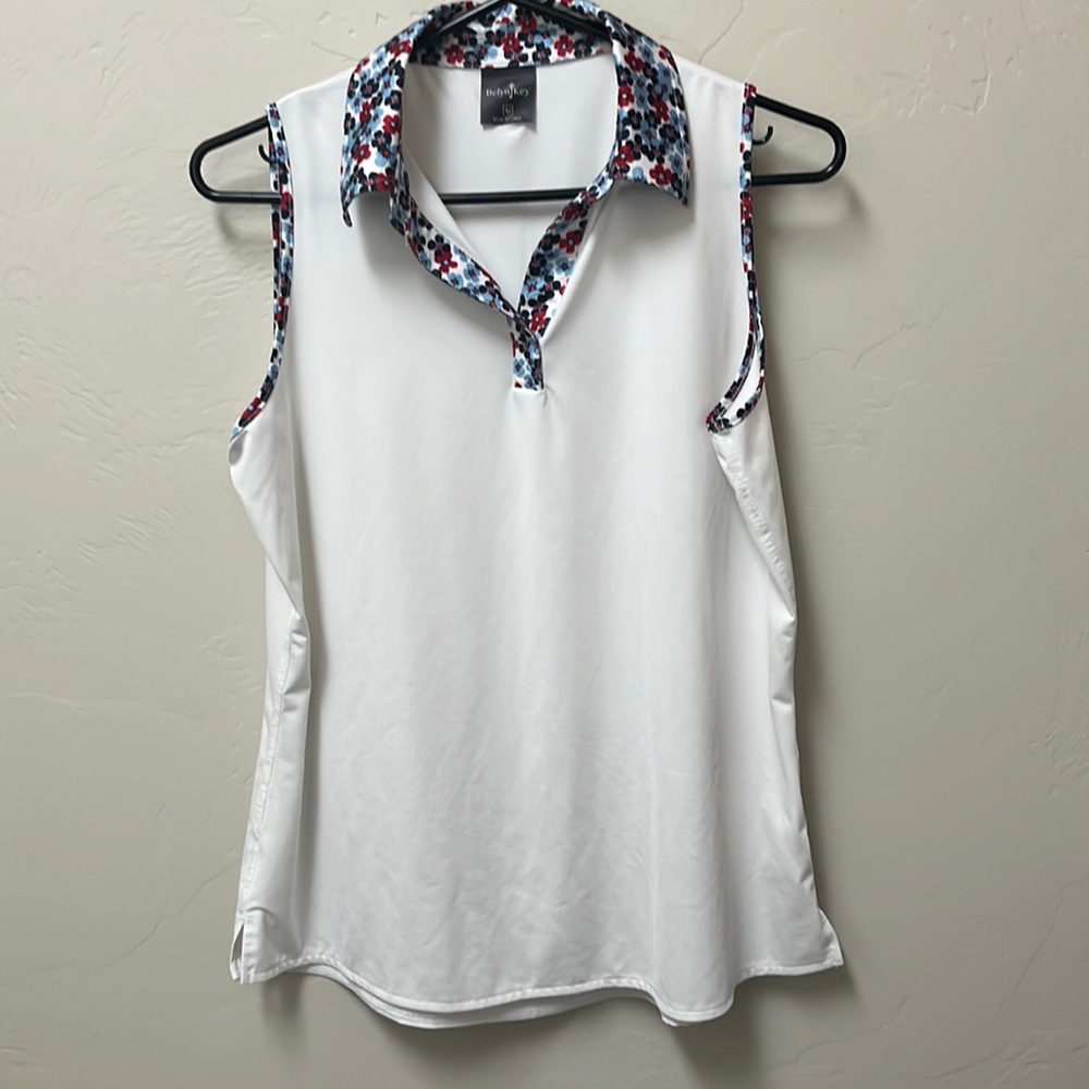 Belynkey sleeveless top. White w red and blue trim. Medium. Like new condition